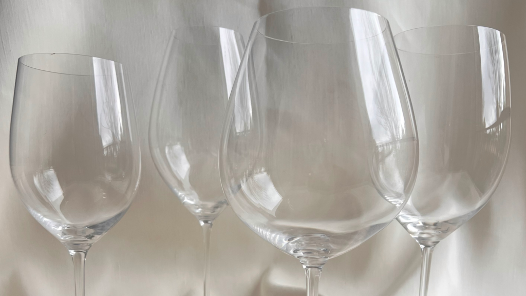 Four wine glasses side by side showing differences in bowl and size