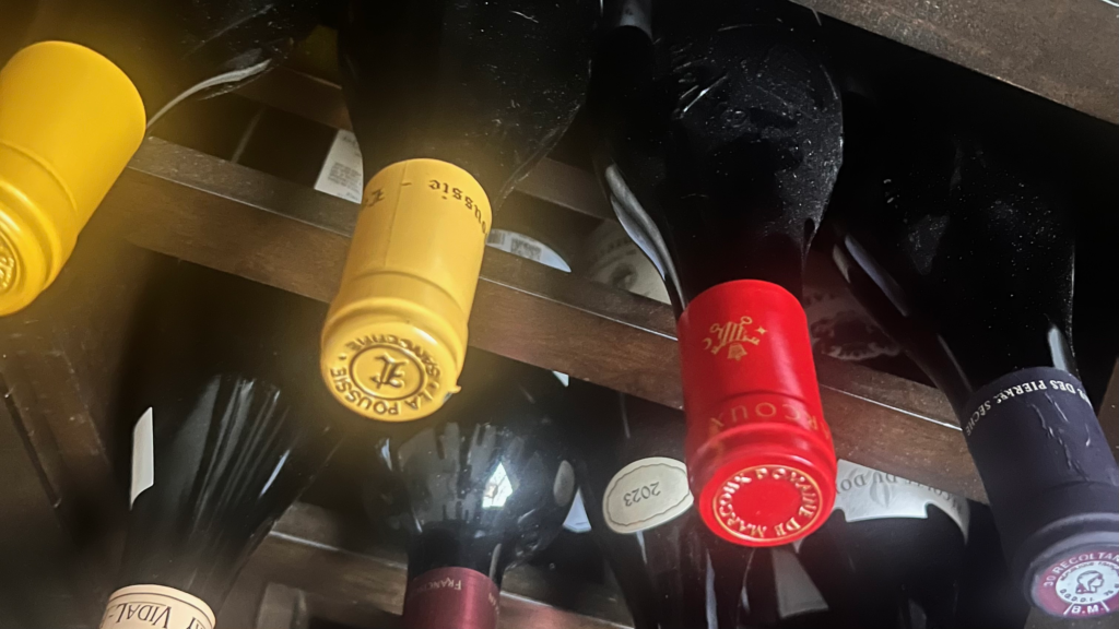 Wine bottles storred horizontally on a home shelf showing practical everyday wine storage