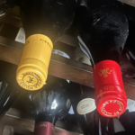 Wine bottles storred horizontally on a home shelf showing practical everyday wine storage